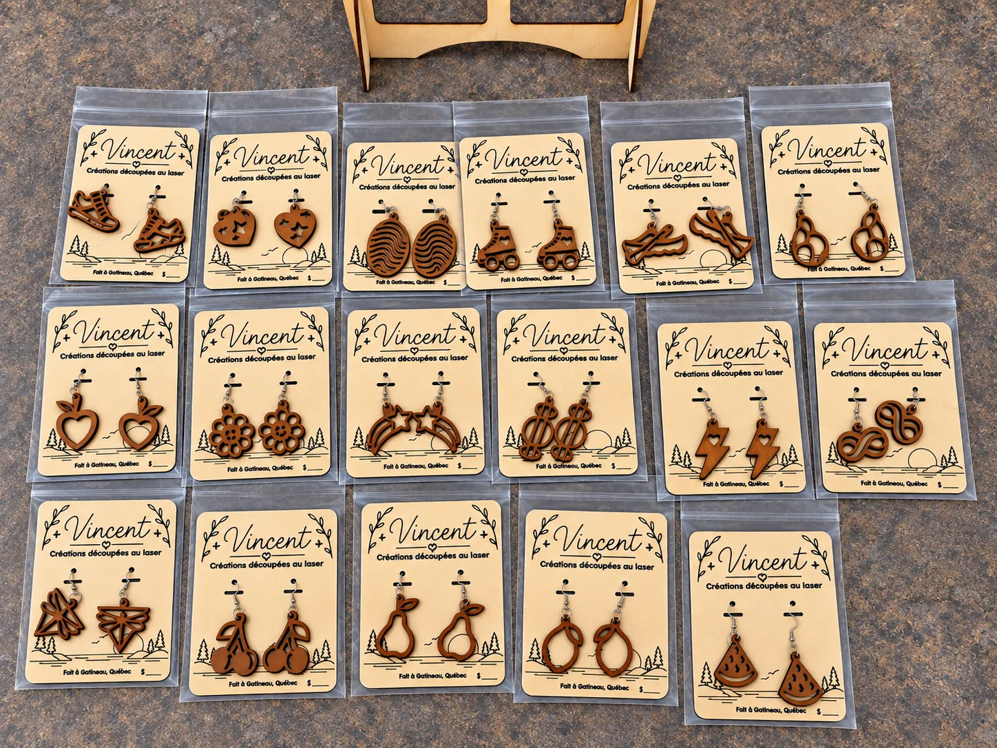 Collection of individually packaged Art Vincent wooden earrings